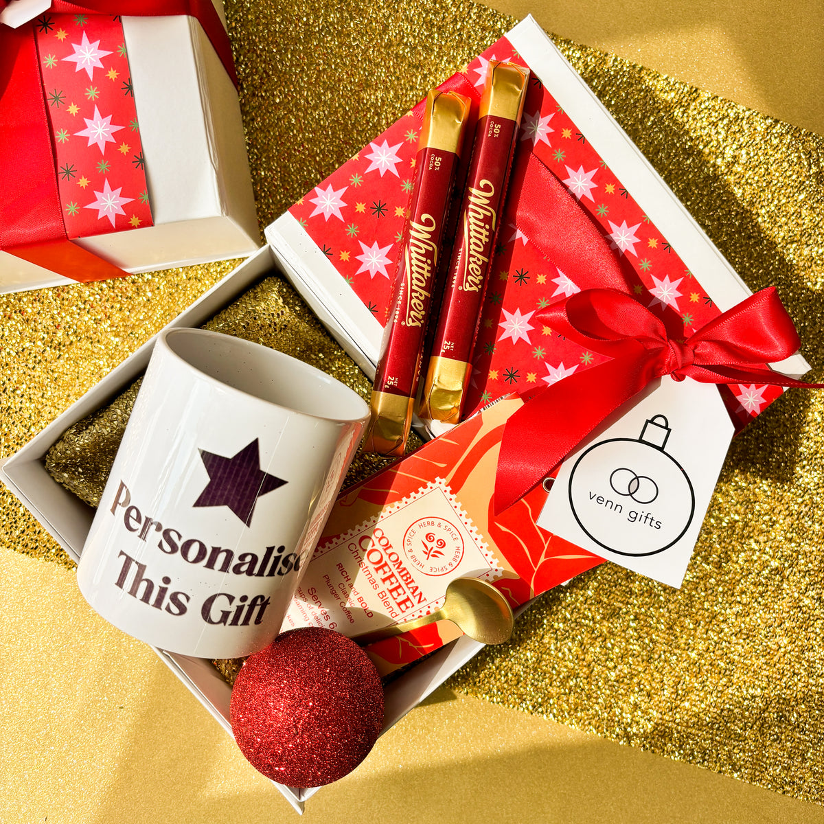 Personalised mug, chocolates and coffee within a white gift box with red wrapping and red bow by Venn Gifts.