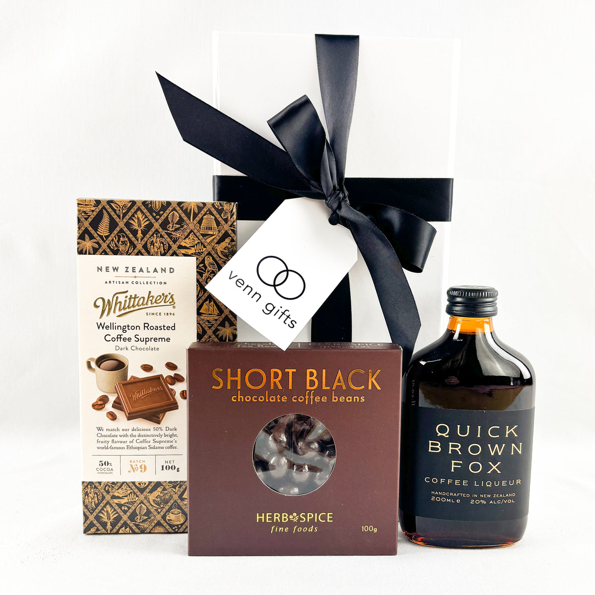 Whittakers Artisan Chocolate with chocolate covered coffee beans and Quick Brown Fox offee liquer against a white background by Venn Gifts.