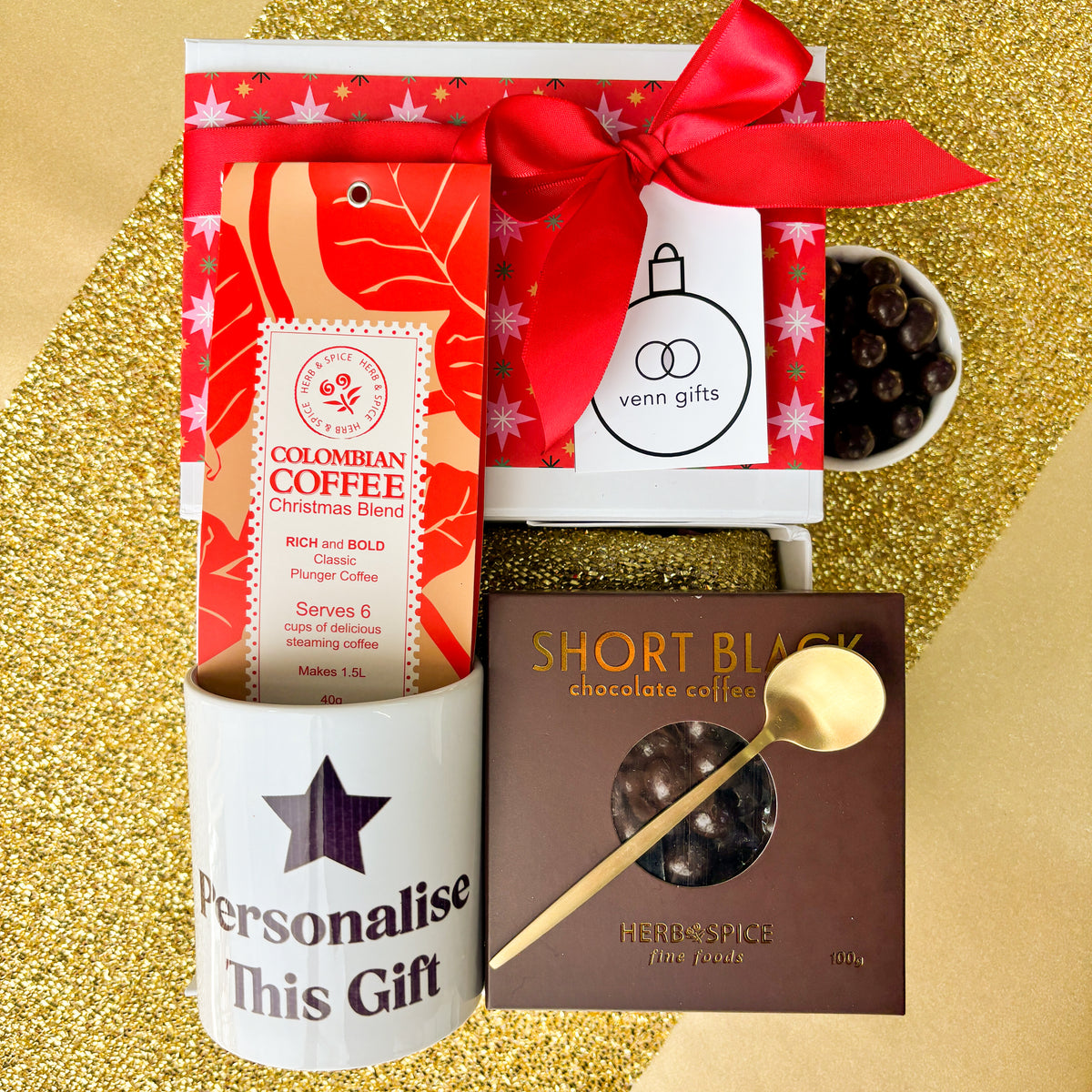 Coffee snacks and customised mug against a gold background by Venn Gifts.