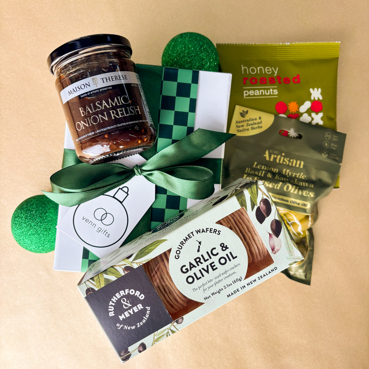 Gift box of savoury snacks and relish inside a white gift box with green bow by Venn Gifts